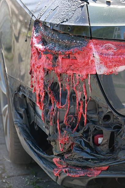 istock A car has been in an accident and has been covered in red paint 2214608279
