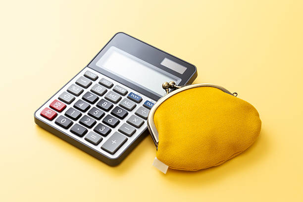 istock Calculator and wallet on a yellow background. 2214608511