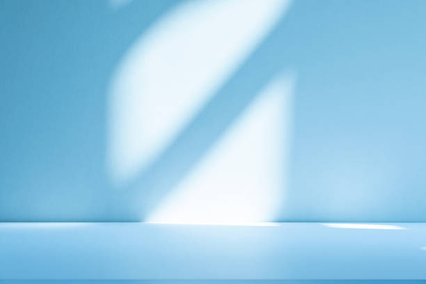 istock Studio style background wall decoration presentation uses white and blue tones. with shadows cast from a nearby window, concept creating a decorative 2214611144