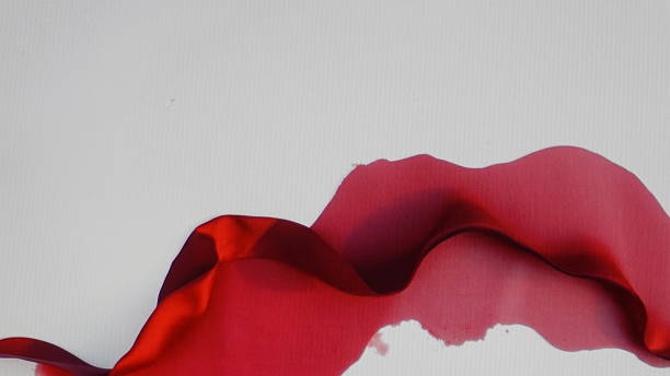 istock Abstract red fluid art, flowing, dynamic, textured, swirling design on white background 2214612724