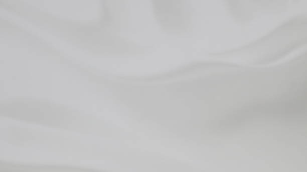 istock Soft, subtle grayscale texture with flowing, draped fabric-like folds 2214612949