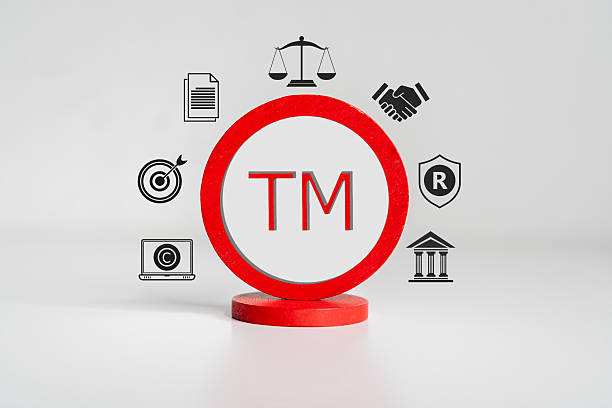 istock A professional holding a registered trademark stamp, symbolizing brand protection and intellectual property. 2214615547