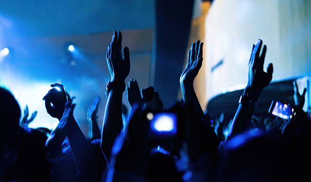 istock People clapping hands at music festival 2214618897