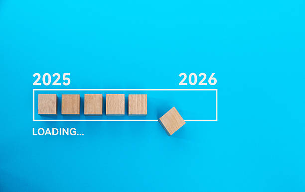 Loading bar with wooden blocks 2025 to 2026 on blue background
