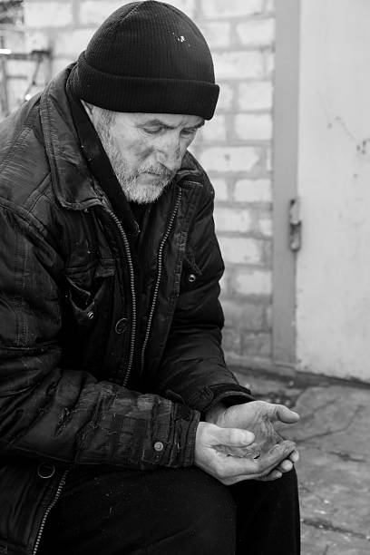 Sydney, Australia - December 29, 2024: Martin Pace, Sydney, despair homeless mature male begging in city street, rear view
