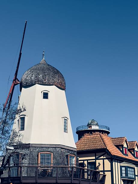 istock An iconic Danish-style windmill stands prominently next to an adjacent building, showcasing the charming architecture of Solvang, California. Located as part of a building hosting multiple retail businesses at 436 Alisal Rd,  Solvang, California. 2214619814