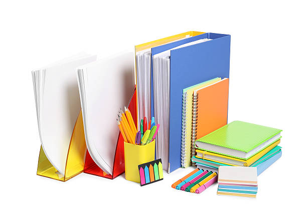 istock Bright office folders and different stationery isolated on white 2214620563