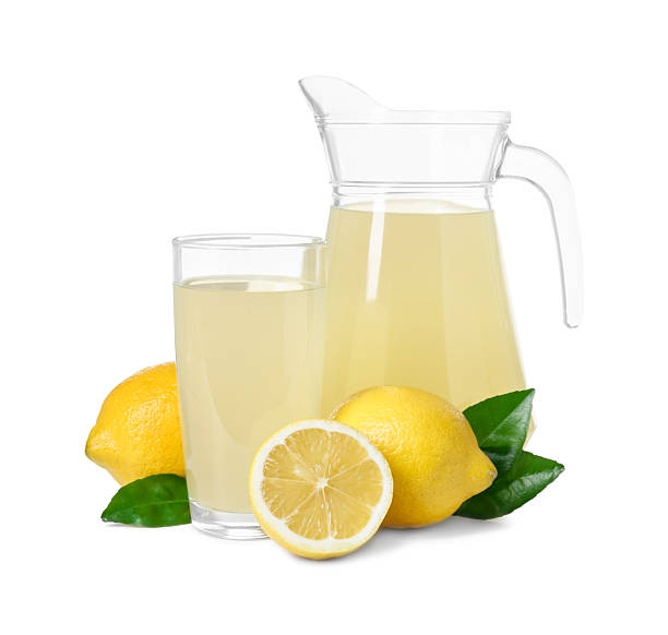istock Refreshing lemon juice, leaves and fruits isolated on white 2214622020