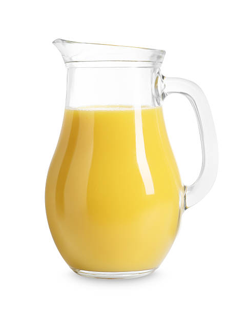 istock Refreshing orange juice in jug isolated on white 2214622050