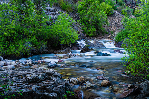 istock Canyon Landscape with Creek Water Flowing Down From Mountains in Springtime 2214622334