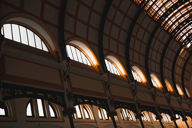 Architectural Marvel Ornate Arches and Windows of a Historic Building Interior.