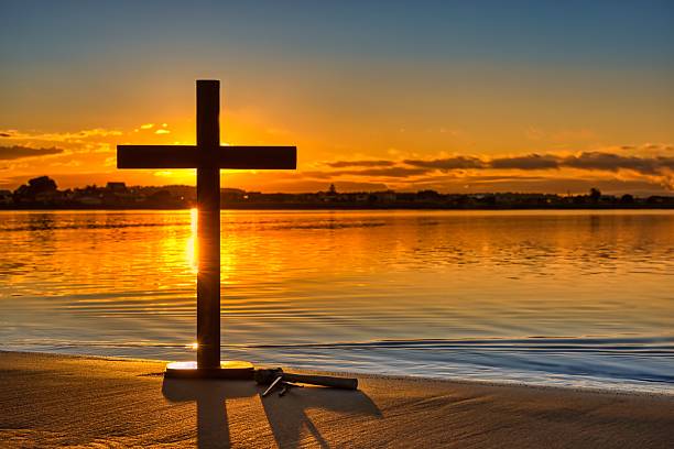 istock Still Waters Cross Sunrise Bay 2214627967