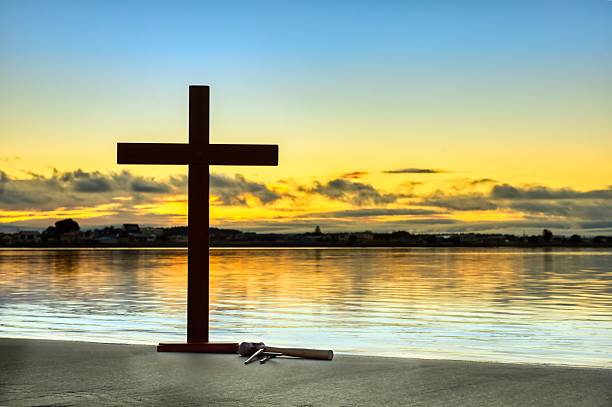 istock Still Waters Cross Hammer With Nails 2214627970