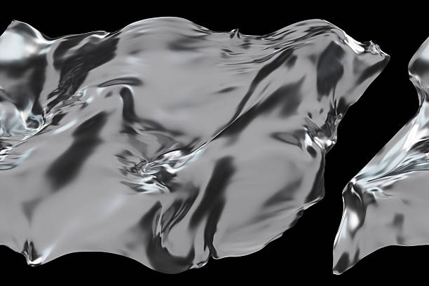 istock Dynamic chrome shapes flow gracefully across a black backdrop, illustrating the interplay between light and shadow in an abstract 3D render that captivates the eye 2214631322