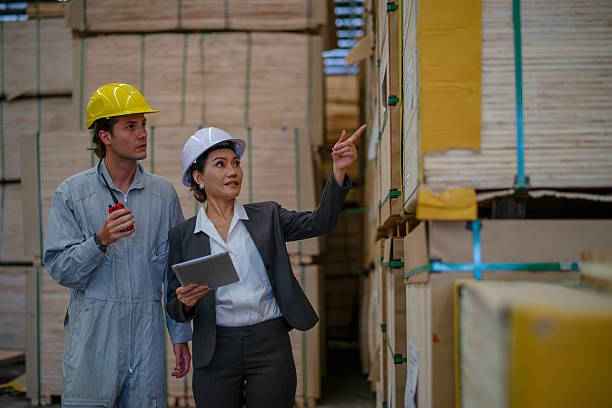 istock Blue collar workers  are working at wood factory. 2214632560