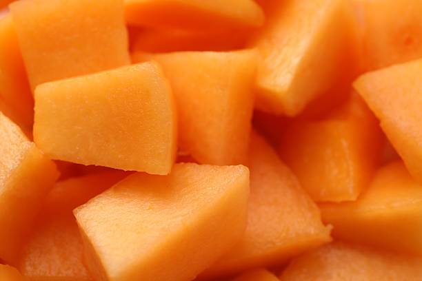 istock Pieces of Cantaloupe melon as background, top view 2214637240