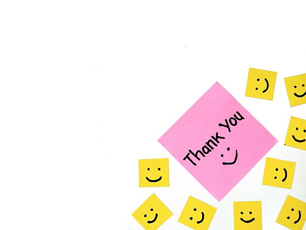 istock Thank you message on pink note paper isolated on white background 2214638587