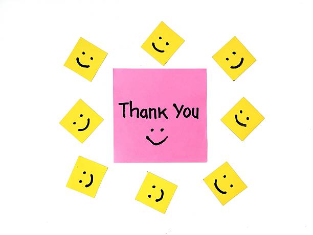 istock Thank you message on pink note paper isolated on white background 2214638590