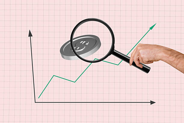 istock Creative collage picture human hand magnifying loop investigate explore currency market charts coin money earnings trader 2214640280