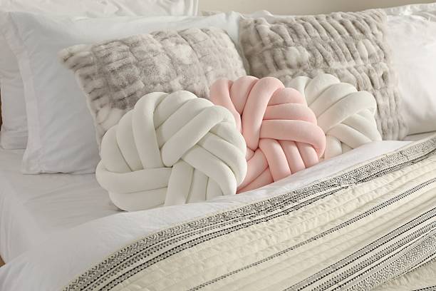 istock Different cushions and blanket on bed, closeup 2214641963