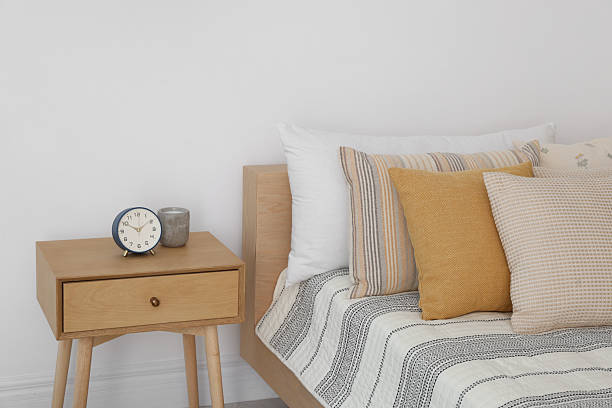 istock Bed with beautiful cushions in room. Interior design 2214641964