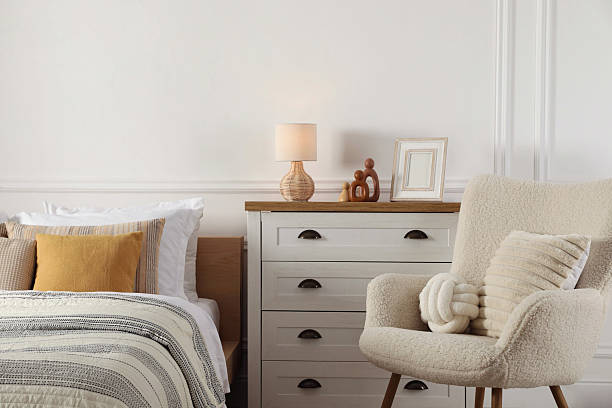 istock Bed with beautiful cushions in room. Interior design 2214641967