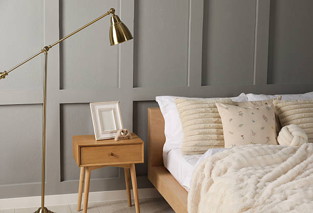 istock Bed with beautiful cushions in room. Interior design 2214641975