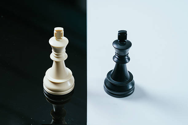 istock Two kings facing each other on chessboard reflecting strategy and competition 2214642763