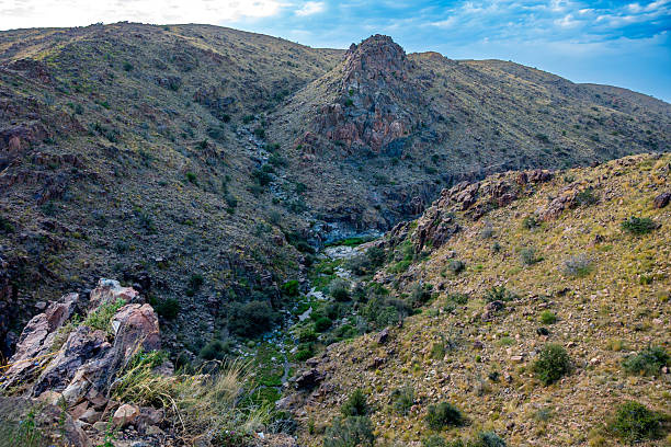 istock A beautiful mountain landscape with blue sky and stream flowing through the valley, from Al hada, Taif, Saudi Arabia 2214643636