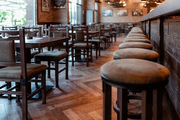 istock Cozy Bar Setting with Wooden Counter and Retro Decor 2214644386