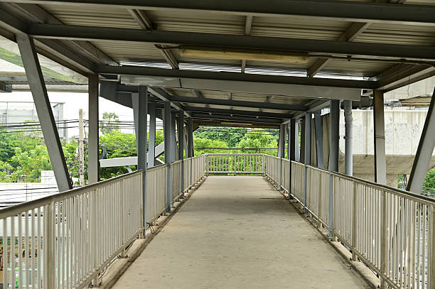 istock Horizontal Foot Bridge Crossing. A muted footbridge pathway. 2214646260