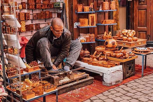 Buenos Aires, Argentina - December 11, 2011: Artisan leather working, saddler. Stall sale in Mataderos Fair. Sale of belts and other leather products. Mataderos neighborhood.