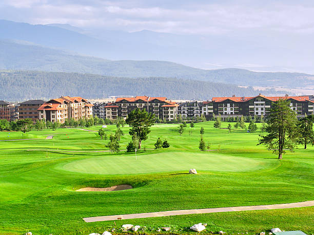 istock A green field with a golf course in the background 2214647491