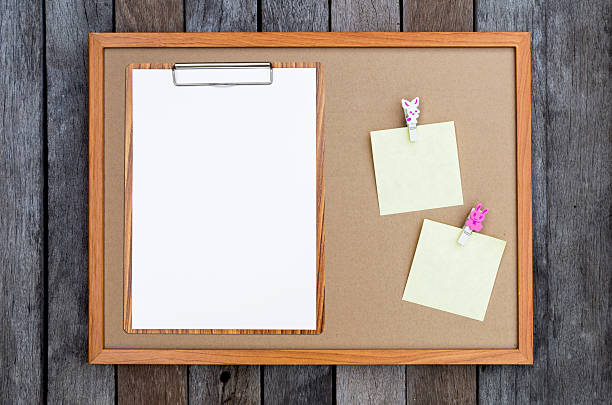 istock Blank paper report on wooden clipboard with notepad on blank card board background 2214648044