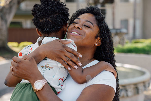 istock Single mother with her daughter at the park 2214648253