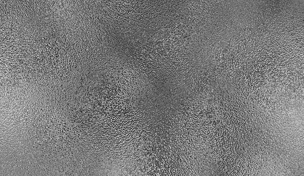 istock gray foil glass texture background. Abstract gradient bright light reflection and shiny rough texture surface 2214648542