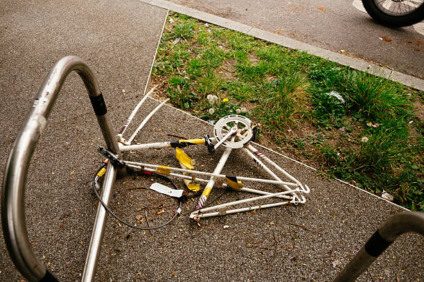 The skeleton of a bike with stolen wheels and others