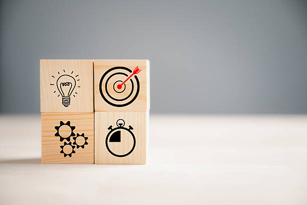 istock Wooden block cude step on table with Action Plan 2214650468