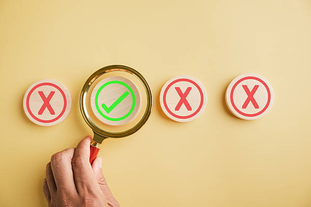 istock Hand with magnifying glass symbolizes business decision-making 2214650499