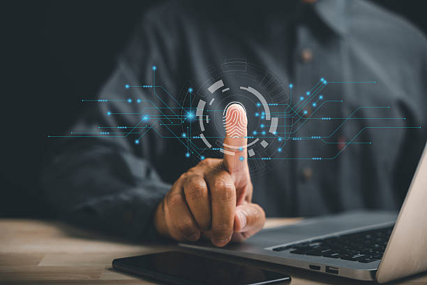 istock Futuristic biometric identification fingerprint scanner providing secure access to personal financial data 2214650514