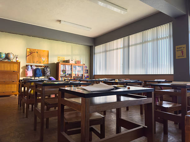 An empty classroom during a class break with the normal decor of an educational space