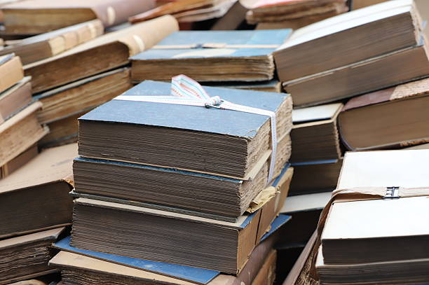 istock A pile of old books and documents, ready to be destroyed for recycling. 2214656232