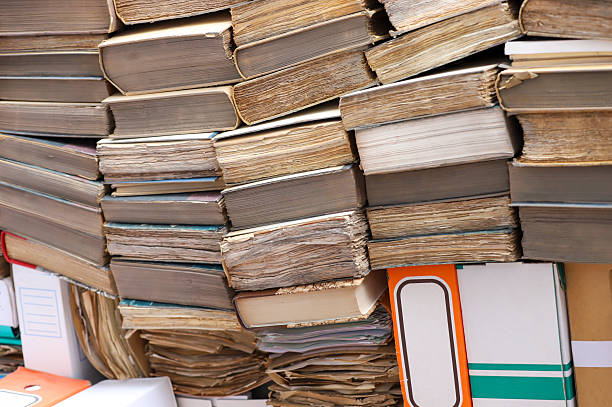 istock A pile of old books and documents, ready to be destroyed for recycling. 2214656248