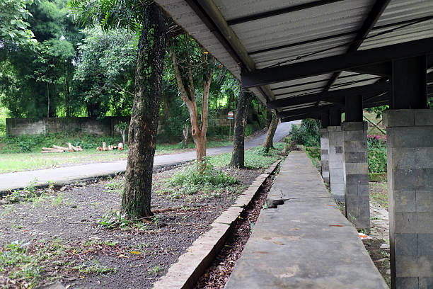 istock Rural roadside with concrete shelter and trees 2214656469