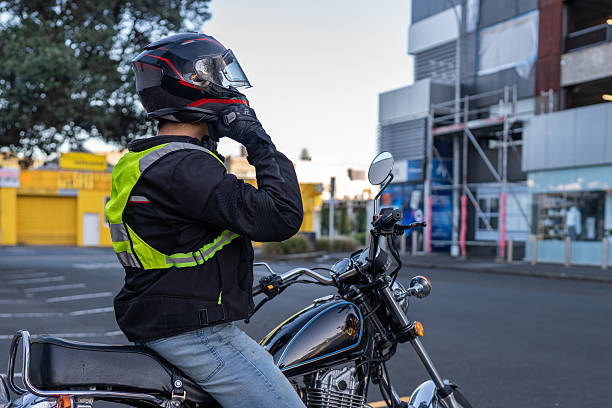 istock Motorcyclist Fastening Helmet Before Urban Ride 2214657842