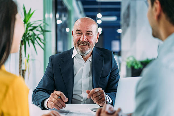 istock Group of business persons talking in the office. 2214670335