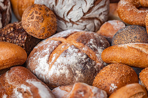 istock Freshly baked natural bread is on the kitchen table. 2214670425