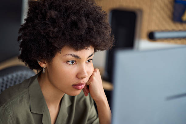 istock Busy African American girl student learning online looking at computer, closeup. 2214671385