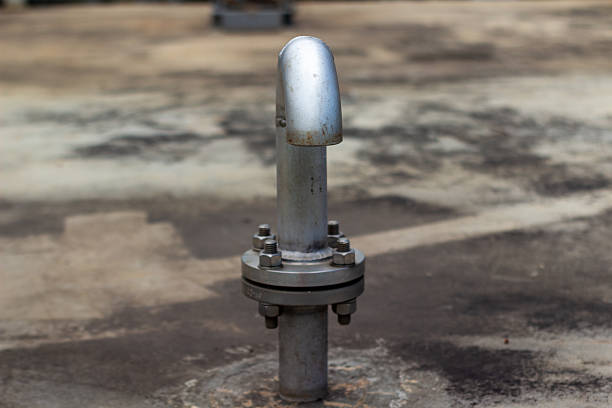 Close-up of industrial venting pipe fitting. Metal pipe flange and bolts