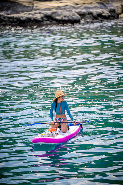 Woman tourist  paddle board at the sea summer, vacation long weekend traveling in island